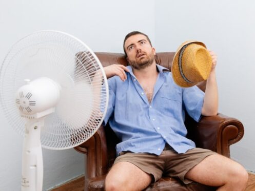 Man Sweating Because He Has No Air Conditioner